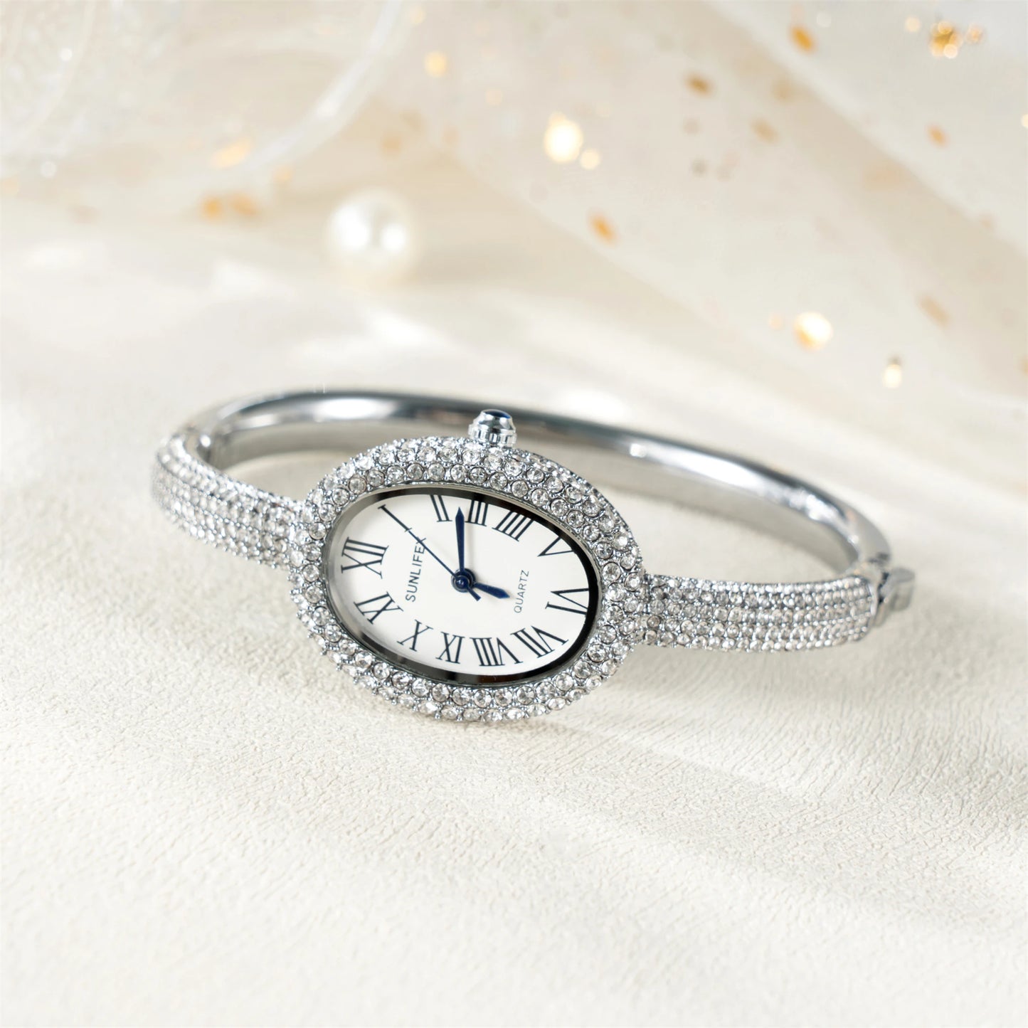 ساعة نسائية فاخرة - ساعة بيضاوية مرصعة بأحجار الراين بأرقام رومانية ومقاومة للماء