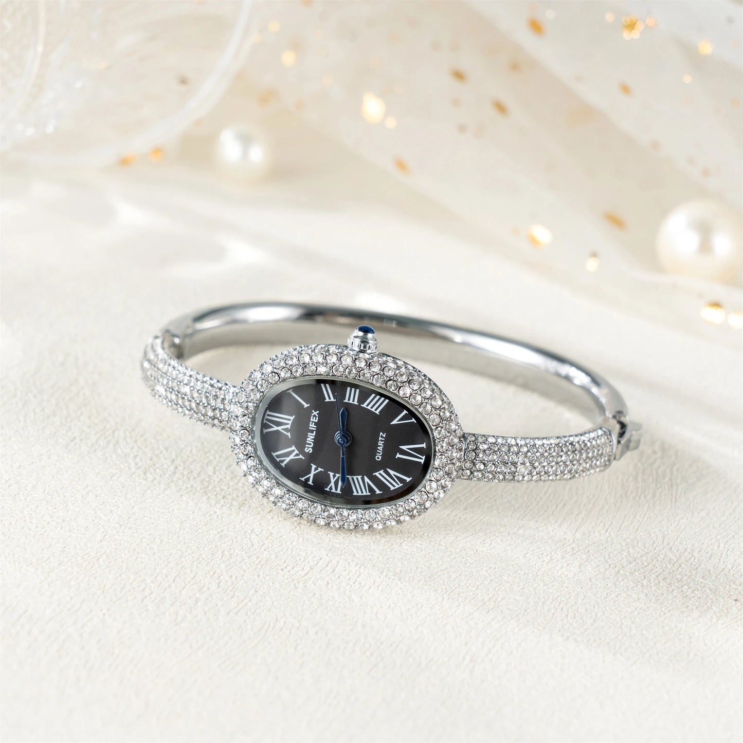 ساعة نسائية فاخرة - ساعة بيضاوية مرصعة بأحجار الراين بأرقام رومانية ومقاومة للماء