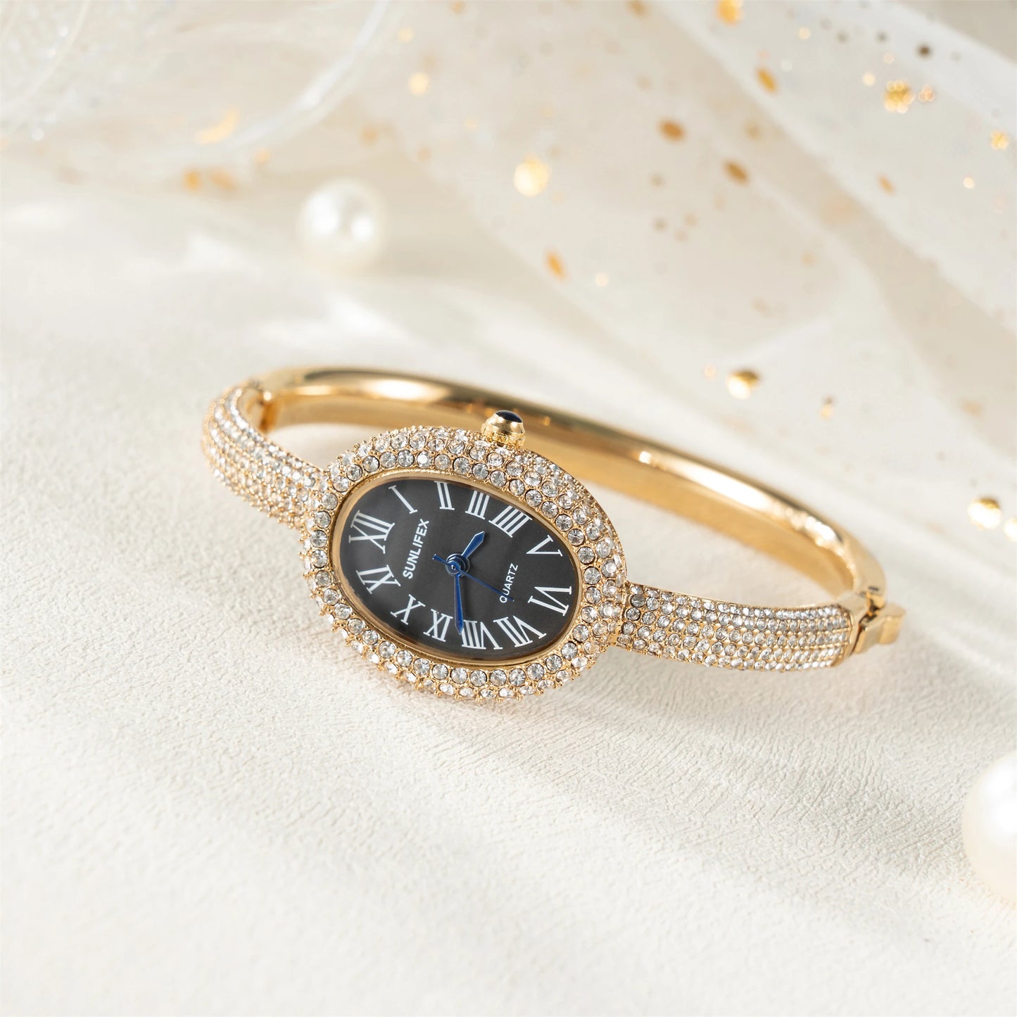 ساعة نسائية فاخرة - ساعة بيضاوية مرصعة بأحجار الراين بأرقام رومانية ومقاومة للماء